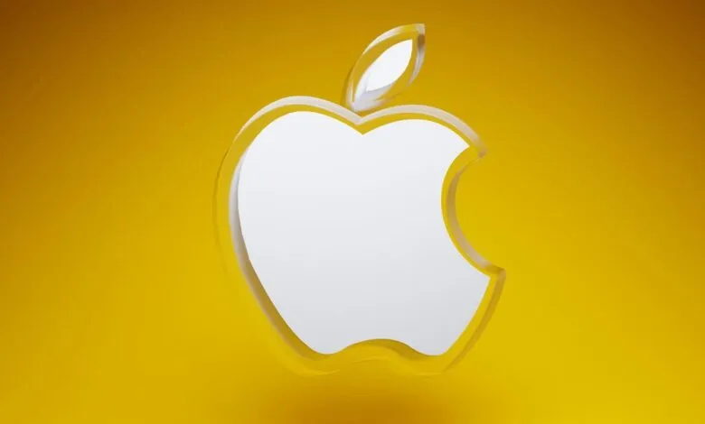 Apple logo with a bite taken out, white on a yellow background.
