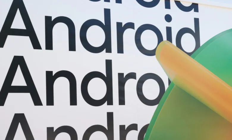 Close-up of Android logo with black text and green/yellow robot figure.