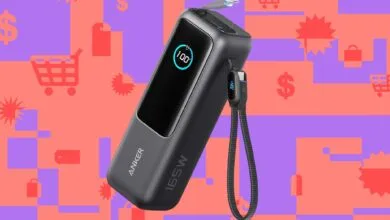 Anker 165W power bank showing 100% charge on a colorful background.