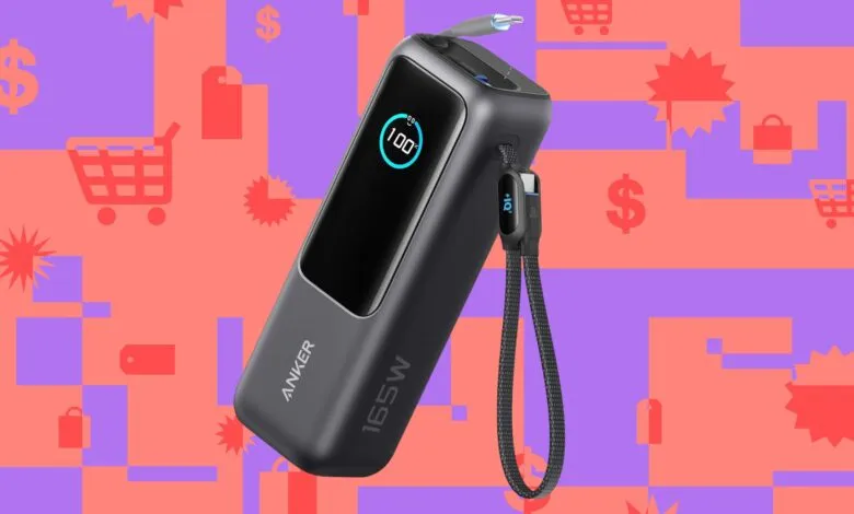 Anker 165W power bank showing 100% charge on a colorful background.