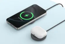 iPhone and AirPods case charging wirelessly on charging pads.
