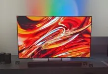 Sony BRAVIA TVs and soundbar on display with vibrant abstract art.