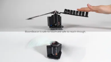 BloomBeacon device with rotating blades and hand interacting with it.