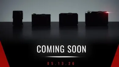 Four silhouetted cameras on a reflective surface with 'COMING SOON' and a date.