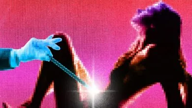 Pixelated image of a hand holding a tool near a figure.