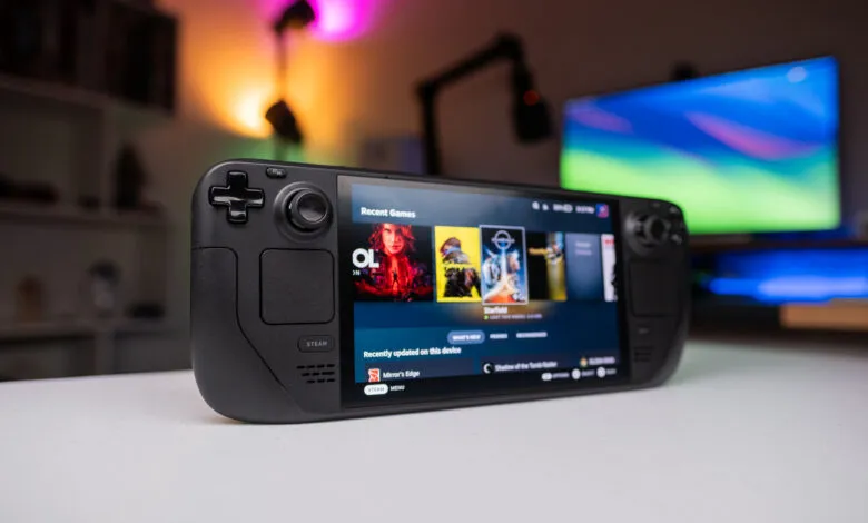 Steam Deck handheld console displaying recent games on its screen.