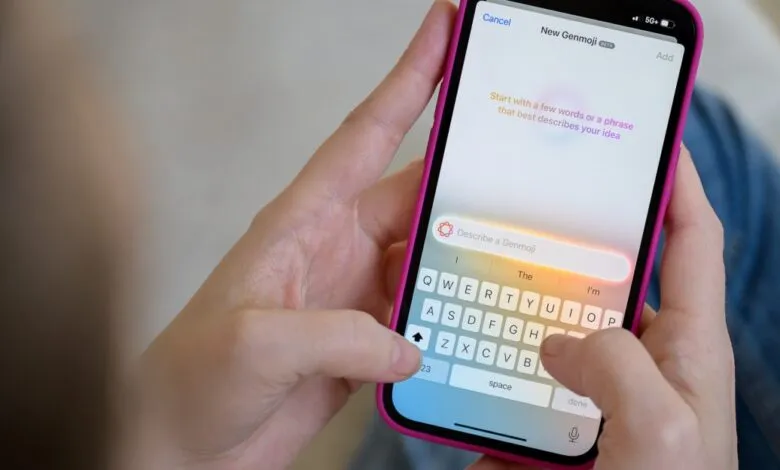 Person using Genmoji feature on iPhone with pink case.
