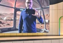 Demis Hassabis presents AI on stage with Mars habitat backdrop.