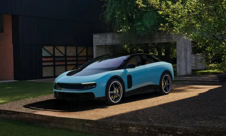 Light blue Ferrari sports car parked on concrete pad in front of modern house.