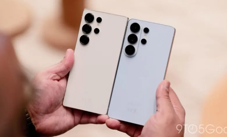 Two Samsung phones, cream and light blue, held in hands showing camera array.