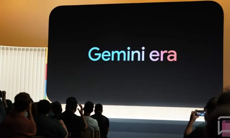 Audience views 'Gemini era' on large screen at tech event.