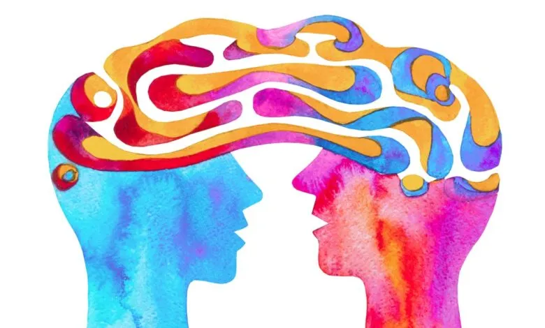 Watercolor illustration of two facing heads with colorful thought patterns.