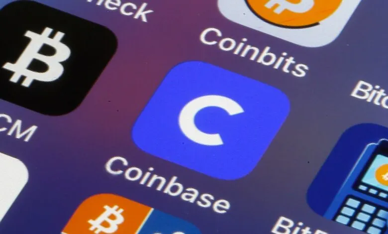 Close-up of phone screen showing Bitcoin, Coinbits, and Coinbase app icons.