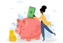 Woman putting money into a pink piggy bank with gold coins nearby.