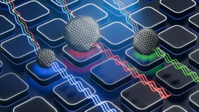 3D rendering shows quantum dots of varying sizes emitting different colored light.