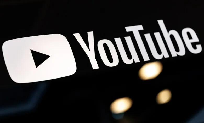 YouTube logo on a black background with play button and text.