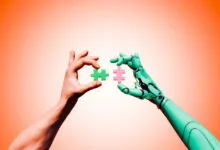 Human and robot hands connect puzzle pieces, symbolizing collaboration.