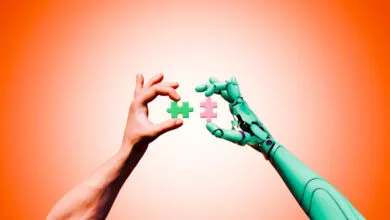 Human and robot hands connect puzzle pieces, symbolizing collaboration.