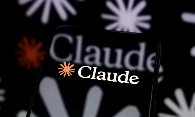 Smartphone displays the Claude AI logo against a floral background.