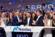 Group celebrates ERVO's IPO at Nasdaq, confetti falling.