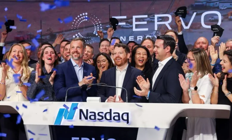 Group celebrates ERVO's IPO at Nasdaq, confetti falling.