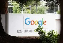 Google sign at 1625 Charleston Road, framed by trees.