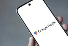 Close-up of a phone displaying the Google Health logo on a white screen.