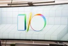 Curved monitor displaying the Google I/O logo on a tiled background.