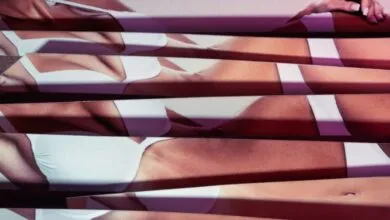 Abstract image of a woman's body in white lingerie, fragmented by horizontal lines.