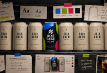 Cold brew coffee cans arranged with branding and design notes.