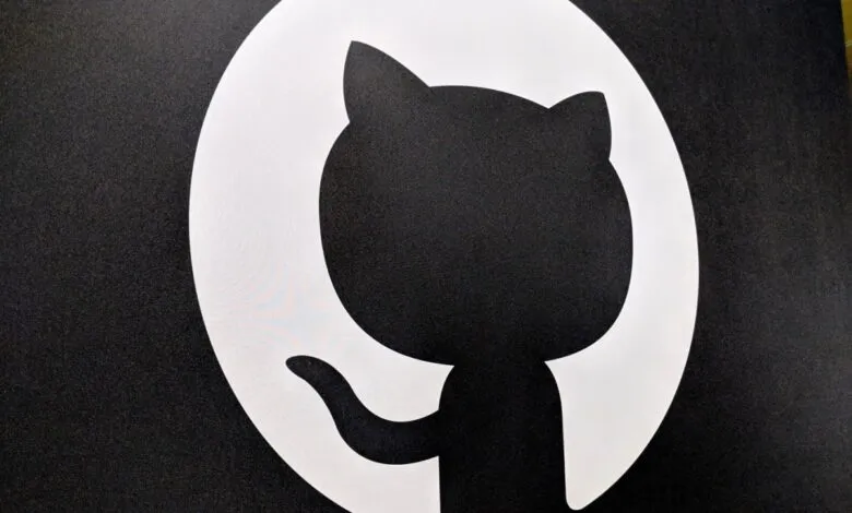 GitHub Octocat logo in black and white, cat-like figure.
