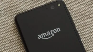 Close-up of the back of a black Amazon Fire Phone with the Amazon logo.