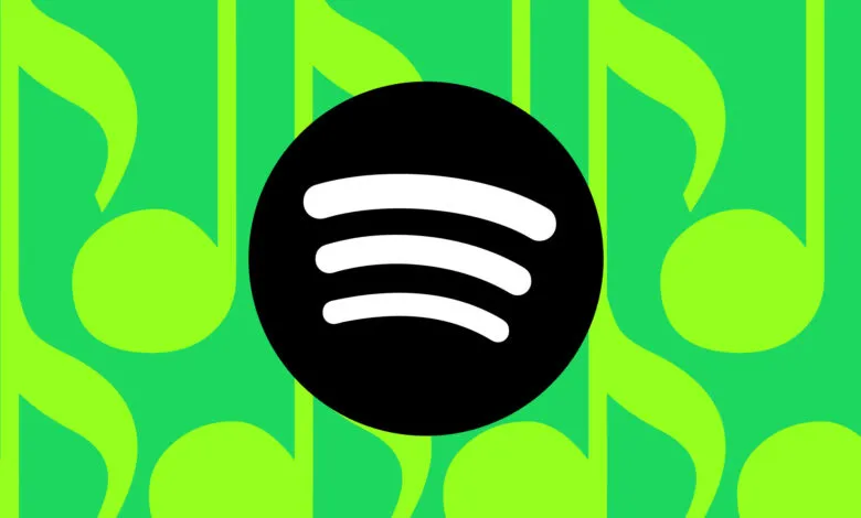 Spotify logo on green musical note background.