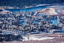 Aerial view of South Lake Tahoe houses on canals, winter scene.