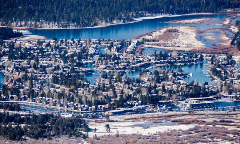 Aerial view of South Lake Tahoe houses on canals, winter scene.