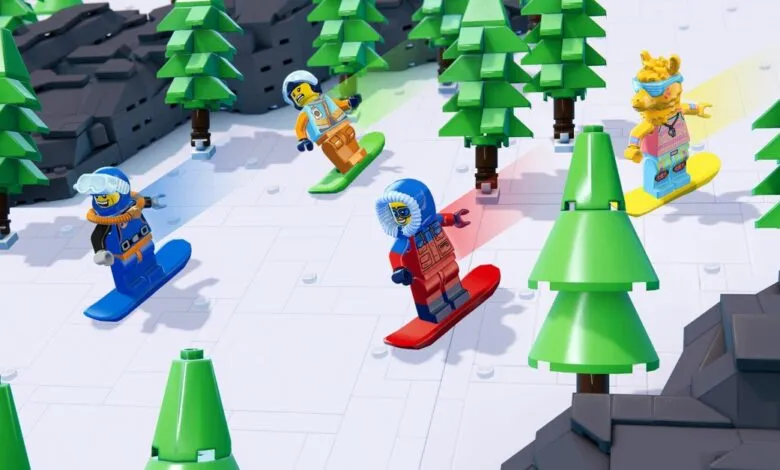 Lego figures snowboarding down a snowy mountain, surrounded by green Lego trees.