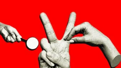 Three hands interact against a vibrant red backdrop, one holding a magnifying glass.