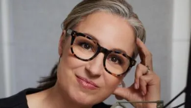 Close-up portrait of Manoush Zomorodi wearing glasses and smiling.