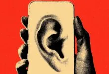 Hand holding phone with large ear graphic, suggesting active listening.