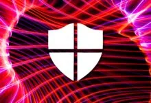 White shield icon against a vibrant, abstract light painting background.