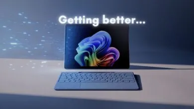 Microsoft Surface tablet with keyboard, displaying Windows 11 desktop and 'Getting better...' text.