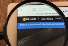 Microsoft Advertising website viewed through a magnifying glass.