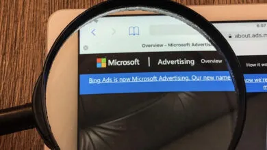Microsoft Advertising website viewed through a magnifying glass.