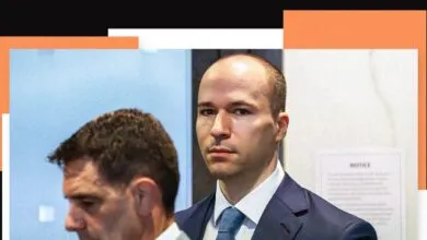 Close-up of Greg Brockman in suit, looking intently at the camera.