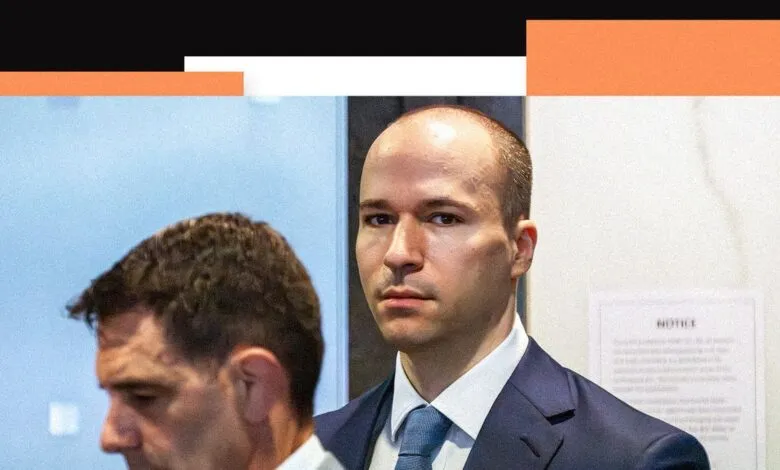 Close-up of Greg Brockman in suit, looking intently at the camera.