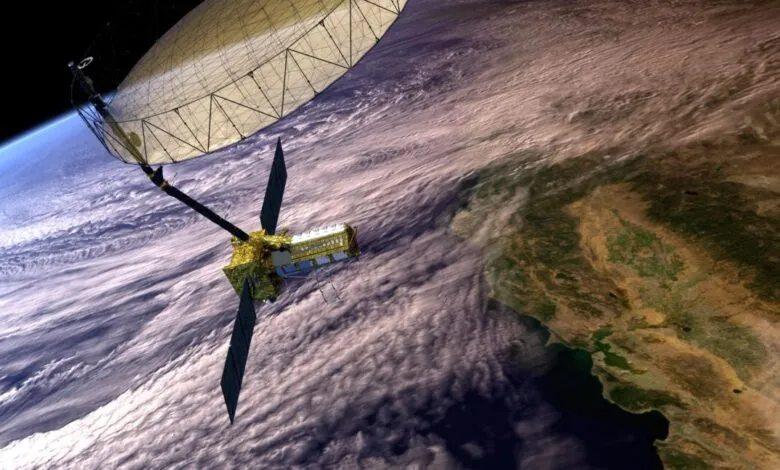 Satellite with large radar antenna orbiting Earth, showing clouds and landmasses.