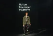 Person sits in front of screen displaying 'Notion Developer Platform'.