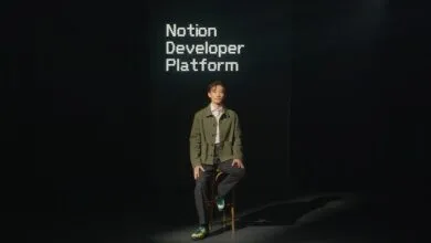 Person sits in front of screen displaying 'Notion Developer Platform'.