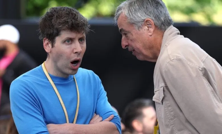 Sam Altman with surprised expression talking to older man.