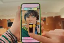 Person playing a mobile game with a face filter eating virtual corn.
